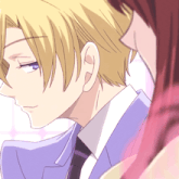 a man in a suit and tie is looking at a woman