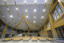 a large building with a lot of windows and a ceiling that looks like a tent