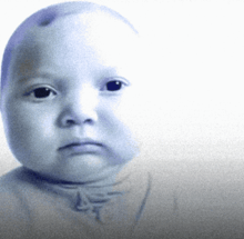 a baby 's face is shown in a blurry photo