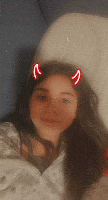 a girl with devil horns on her head