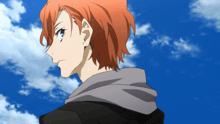 a man with red hair is standing in front of a blue sky with white clouds