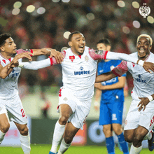 a group of soccer players wearing ingelec uniforms