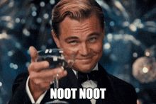 a man in a tuxedo is holding a glass of wine with the words noot noot on it