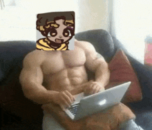 a very muscular man is sitting on a couch using a laptop computer with a cartoon character on his face .