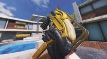 a person is holding a gun with a banana on it in a video game .