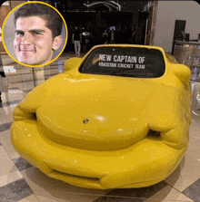 a yellow car with the words new captain of pakistan cricket team on the windshield