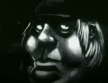 a black and white drawing of a person 's face with glowing eyes
