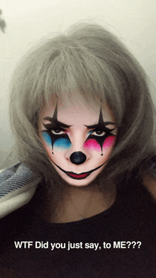 a woman with a clown face painted on her face