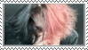 a woman with pink hair is covering her face with her hands in a picture frame .