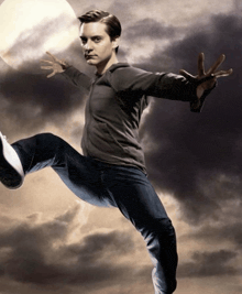 a man with his arms outstretched is kicking something