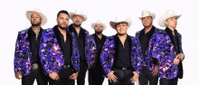 a group of men wearing cowboy hats and sequined jackets