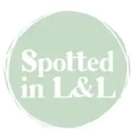 a logo that says spotted in l & l with a santa hat