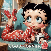 betty boop laying on a couch holding a cup of coffee