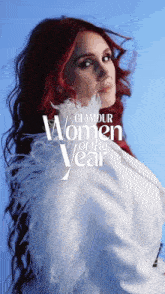 a woman with red hair is featured in a glamour women of the year advertisement