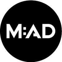 a black circle with the word mad on it