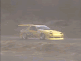 a yellow car with a checkered pattern on the side of it