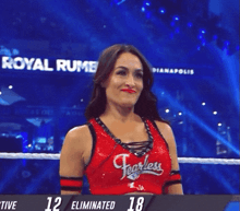 a female wrestler wearing a red top with the word fairley on it