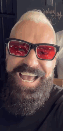 a man with a beard wearing sunglasses and a mustache