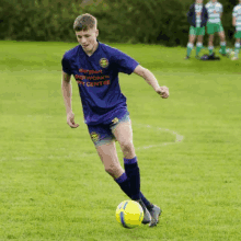 a soccer player wearing a jersey that says maryport bodywork and beauty centre