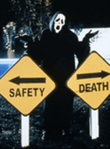 a man in a scream mask is standing next to a safety and death sign