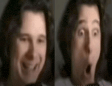 a blurry picture of a person 's face with a surprised look on their face