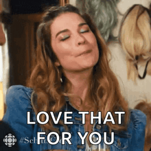 a woman in a denim jacket is making a face and says love that for you