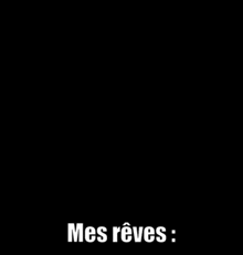 a black background with the words mes reves written in white .