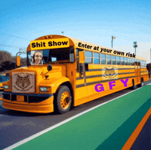 a yellow school bus with the words enter at your own risk gfy on the side