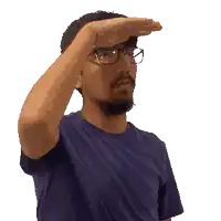 a man wearing glasses and a blue shirt is covering his eyes
