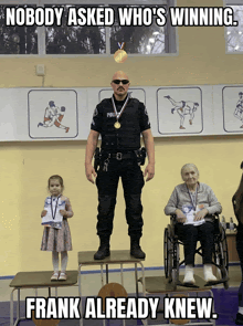 a man in a police uniform is standing on a podium with a little girl