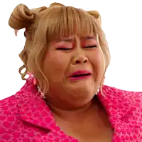 a woman wearing a pink leopard print shirt is crying
