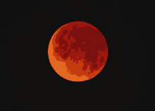 a red full moon in a black sky