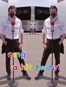 a man wearing a mask stands in front of a microphone with the words " omg a hit tweet " on the bottom