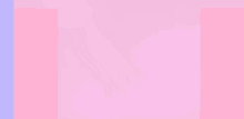 a close up of a person 's hand on a pink surface .