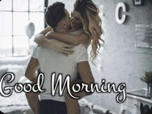 a man carrying a woman in his arms with the words " good morning " written on the bottom