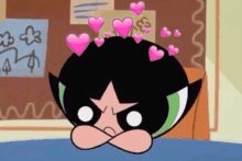 buttercup from the powerpuff girls is sitting on a bed with hearts on her head .