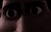 a close up of a person 's eyes in the dark