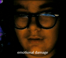 a close up of a man 's face with the words emotional damage written below him