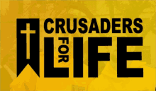 a sign that says crusaders for life with a cross on it