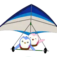 two penguins are sitting under a blue and white striped parachute