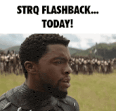a man with a beard is standing in a field with a group of people behind him and the words strq flashback today