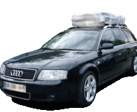 a black audi with a large bag on the roof