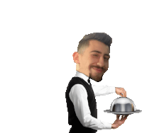 a waiter is holding a silver tray with a dome lid