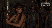 an arrow video advertisement shows a statue of a man