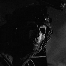 a black and white photo of a person with a skull on their face