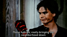 a man holding a bloody apple with the words " these hybrids really bringing the neighborhood down " below him