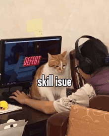 a cat is sitting next to a person playing a video game on a computer screen .