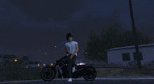 a man sitting on a motorcycle in a video game at night