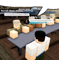 a group of soldiers are sitting around a table in a room with a sign that says recruit basic military training