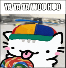 a hello kitty wearing a colorful hat is holding a lollipop